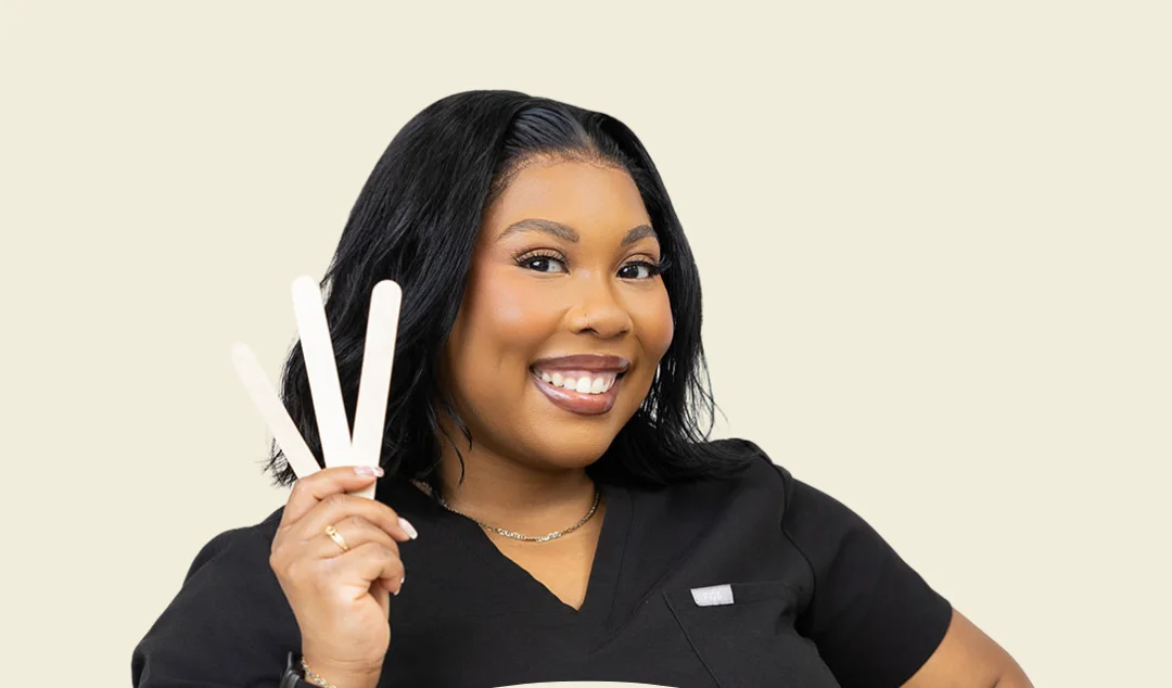 Kristina holding esthetician tools